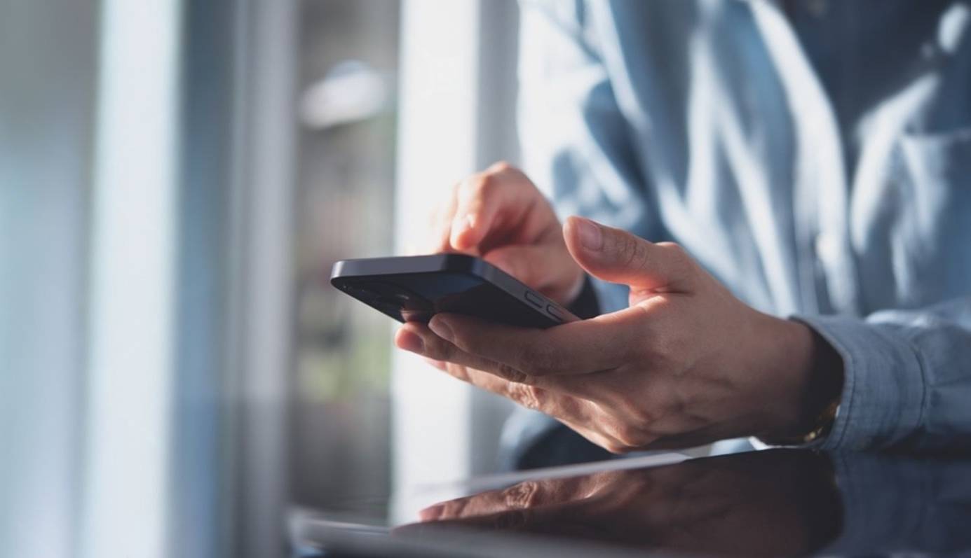 Person using their cell phone after divorce