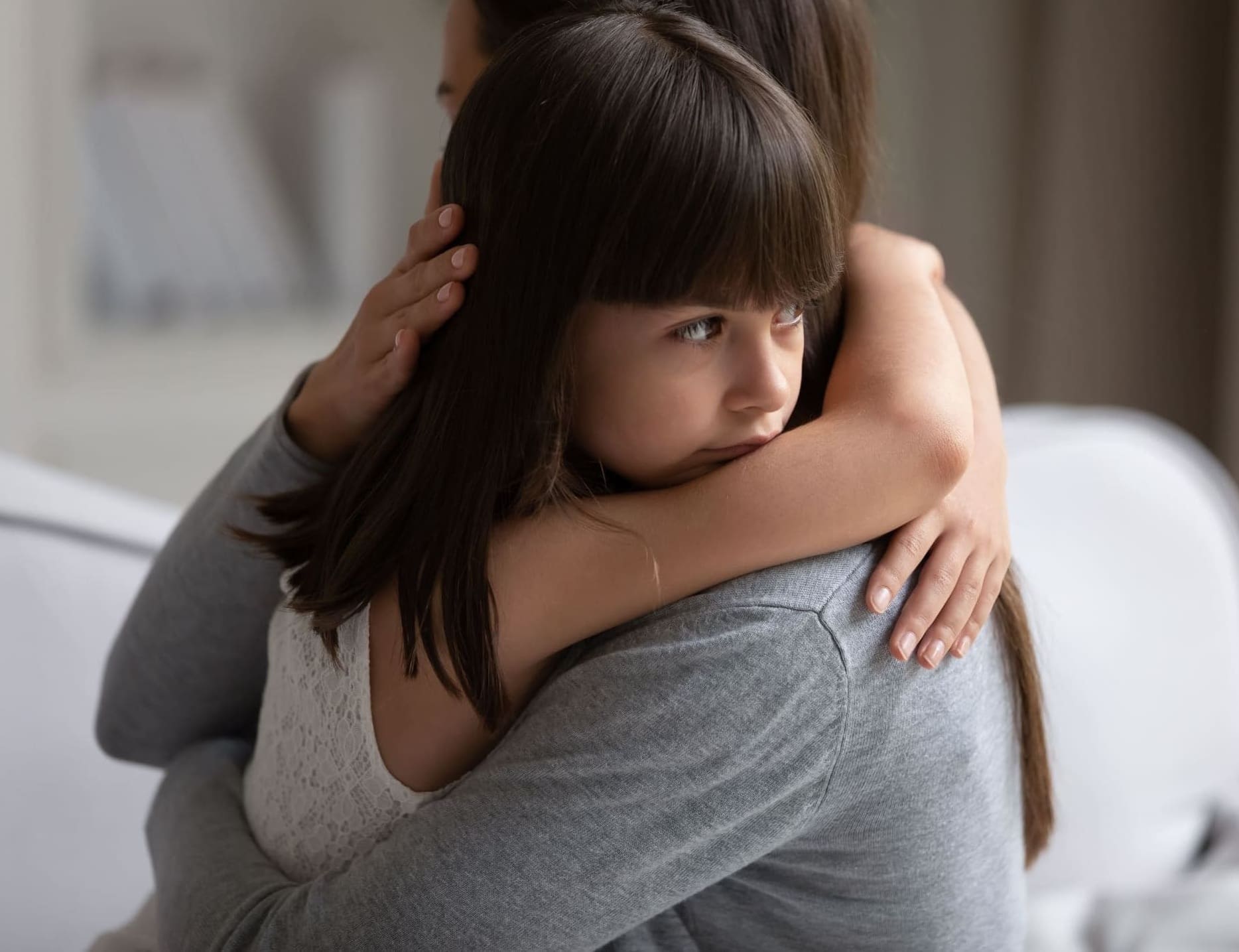 Mother hugging her daughter after visitation refusal